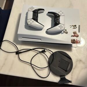 White and Black PlayStation 5 Console with DualSense Controllers